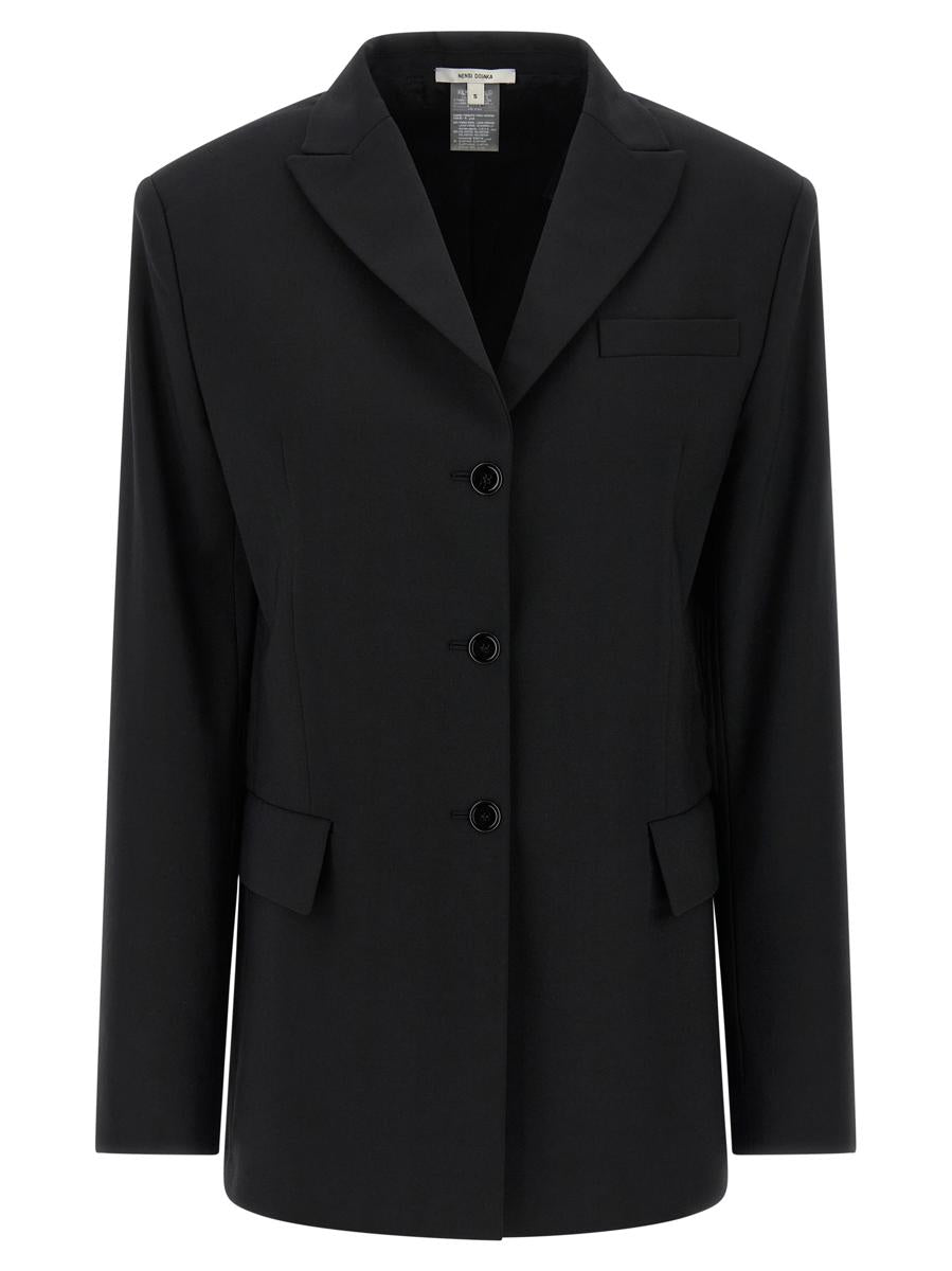 Nensi Dojaka kavaj med bälte