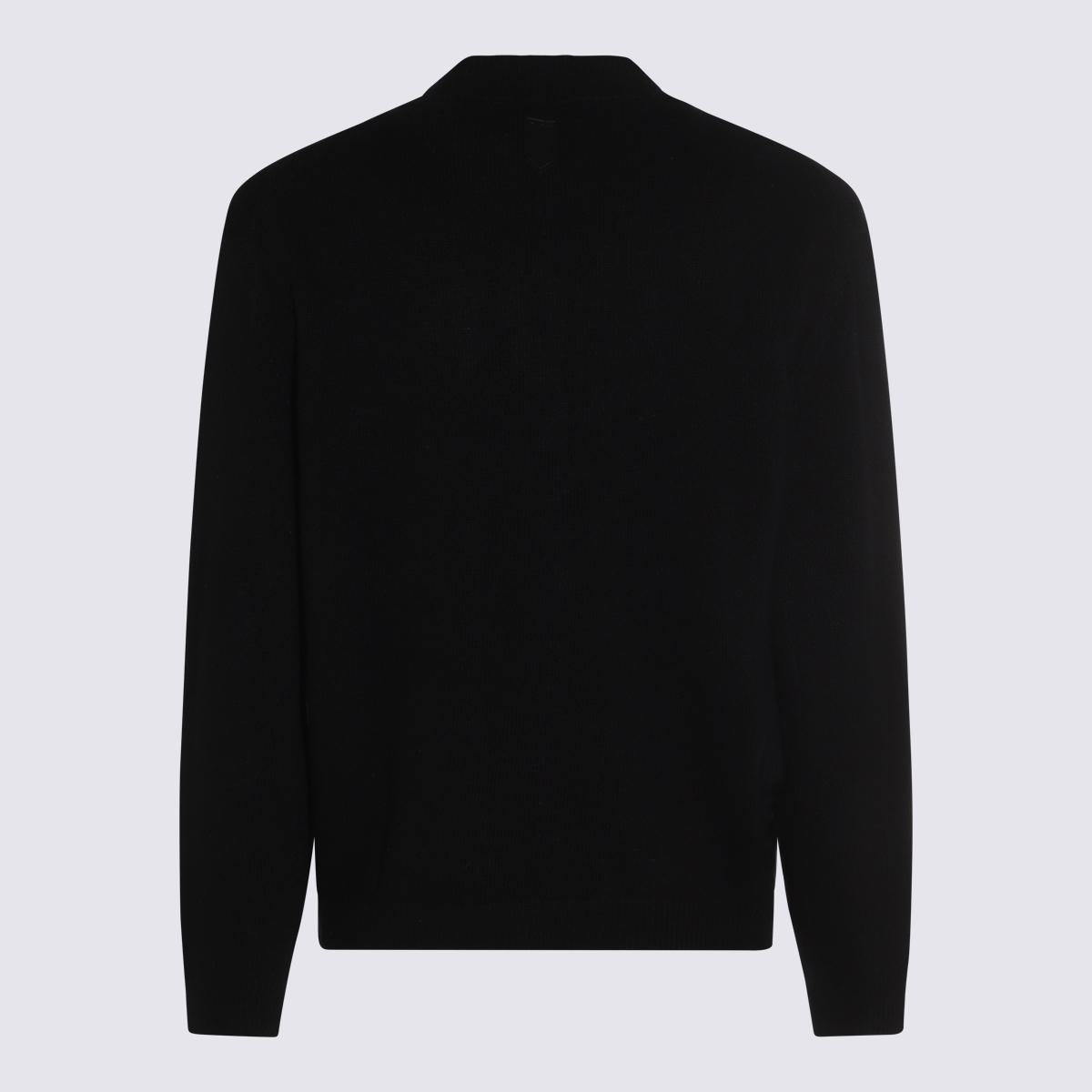 Canali svarta stickade ullplagg