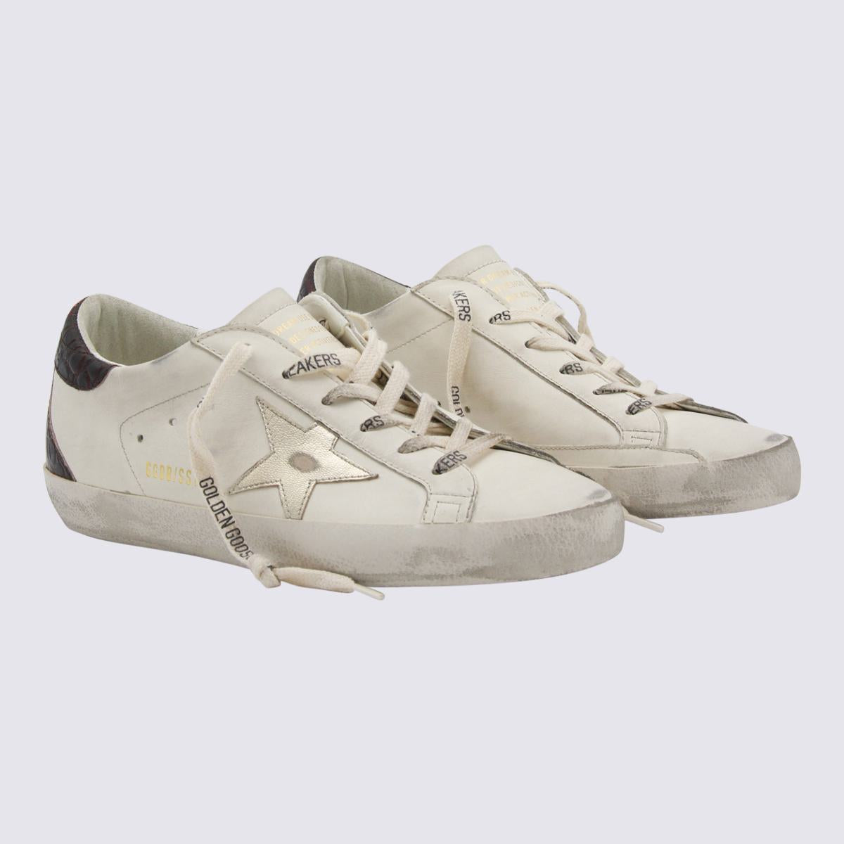 Golden Goose Vita och Svarta Lädersneakers