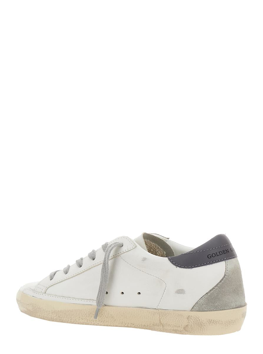 Vita låga sneakers med stjärnmärke i vintageläder för kvinnor