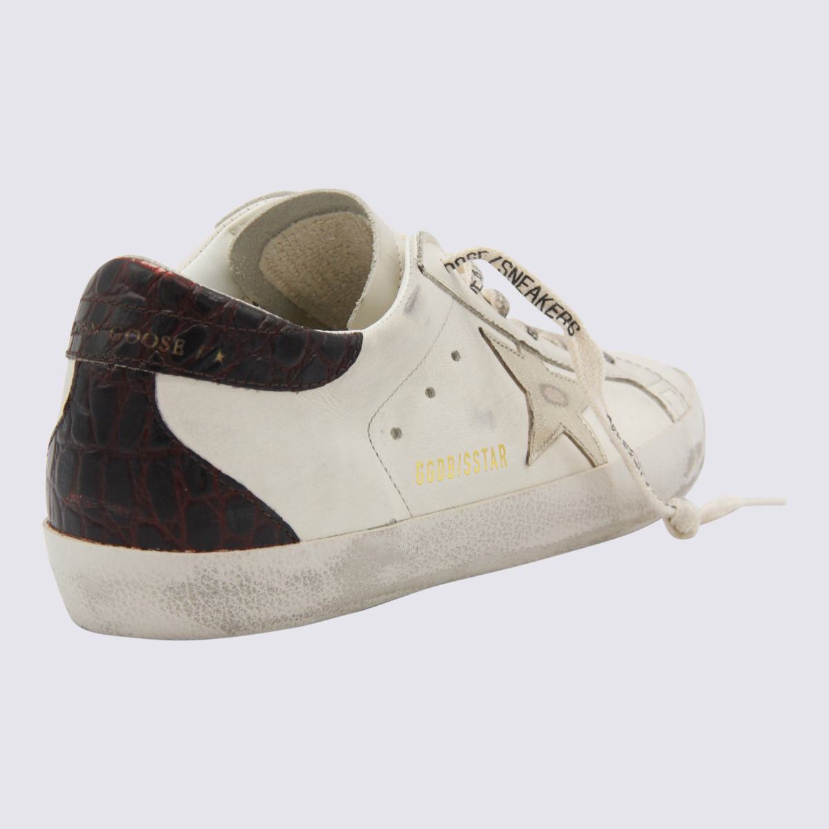 Golden Goose Vita och Svarta Lädersneakers