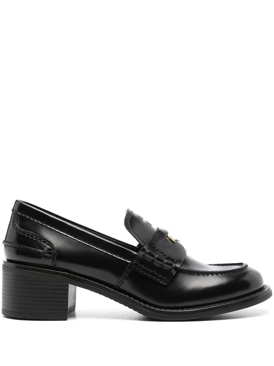 Miu Miu Penny Loafers i borstat läder