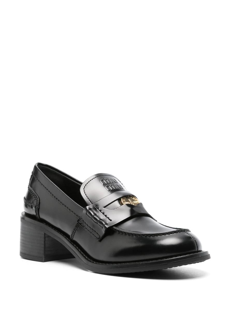 Miu Miu Penny Loafers i borstat läder