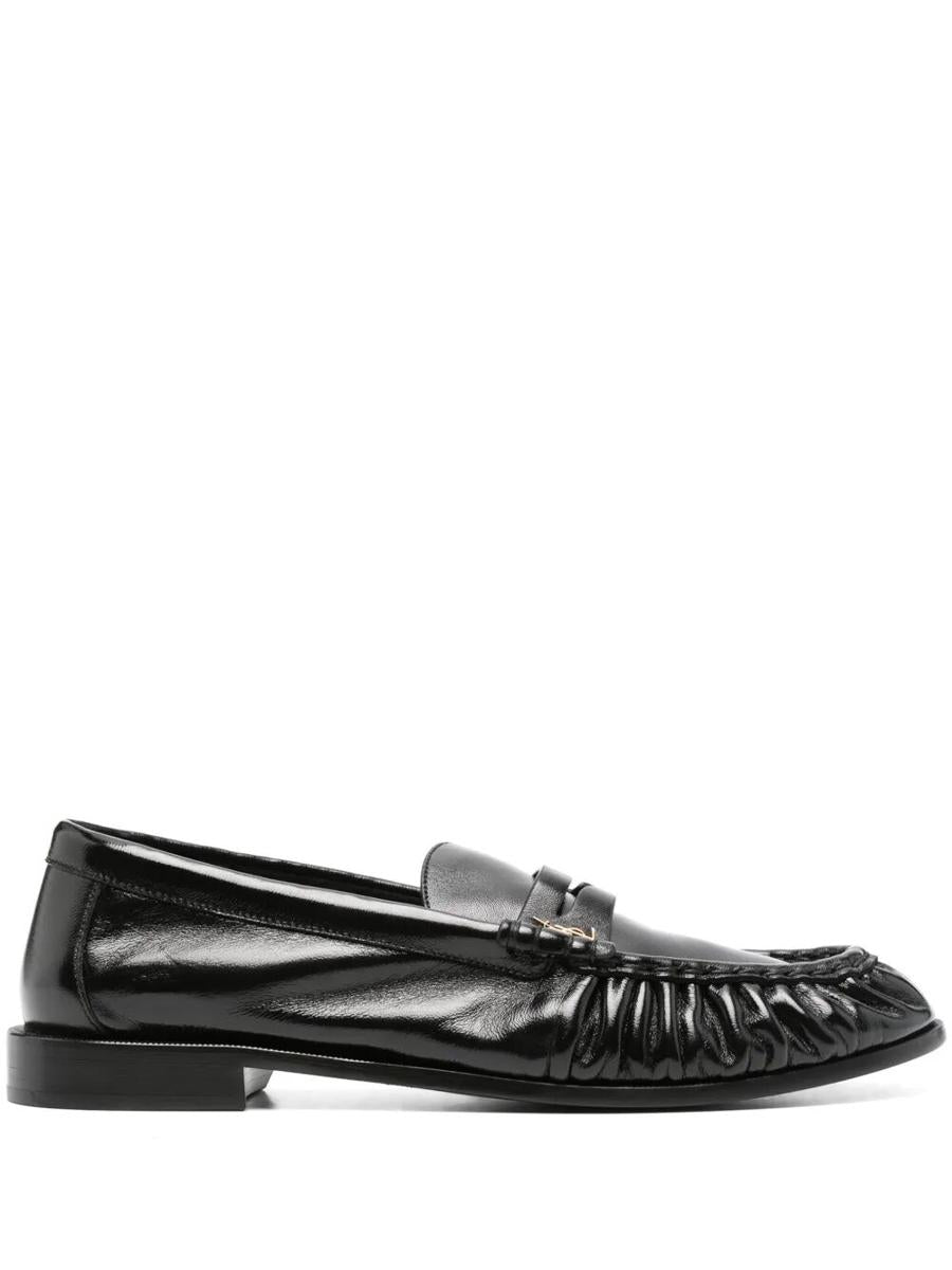 Saint Laurent Le Loafer Smidiga I Glänsande Läderskor