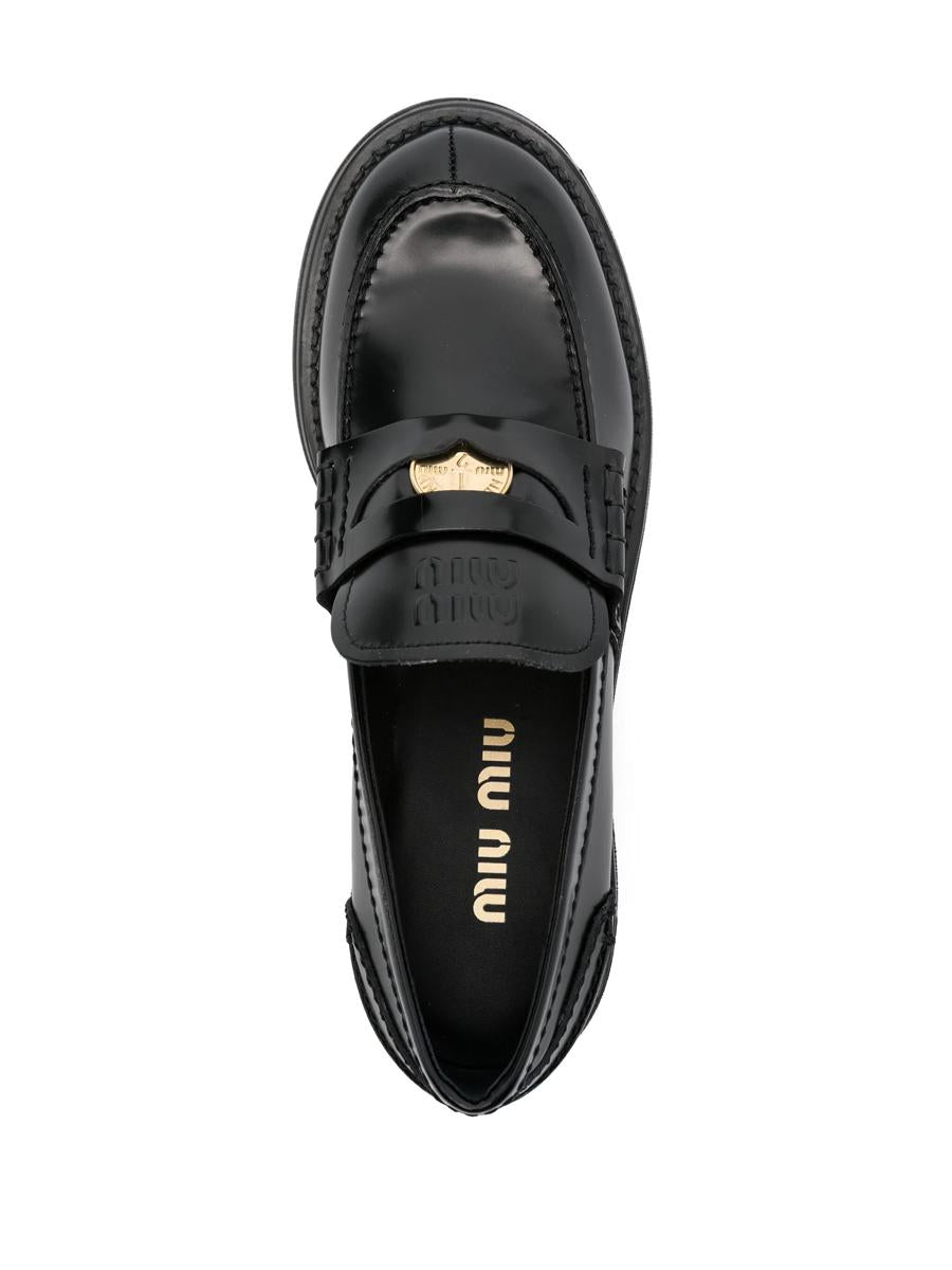 Miu Miu Penny Loafers i borstat läder