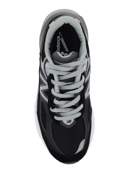 Svarta låga sneakers med logotypdetalj i mocka och tekniskt tyg för kvinnor