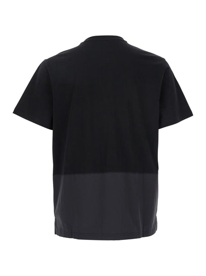 Svart t-shirt med rund hals och logotyp framtill i bomullsmodell med 'Clint'-logotyp