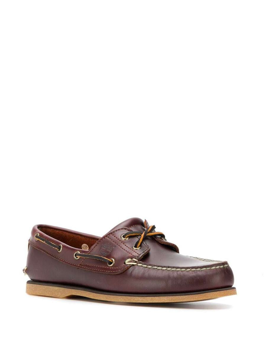 Klassiska båtloafers i brunt läder för män
