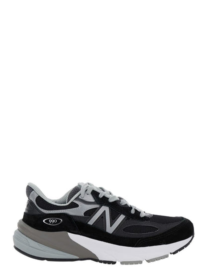 Svarta låga sneakers med logotypdetalj i mocka och tekniskt tyg för kvinnor