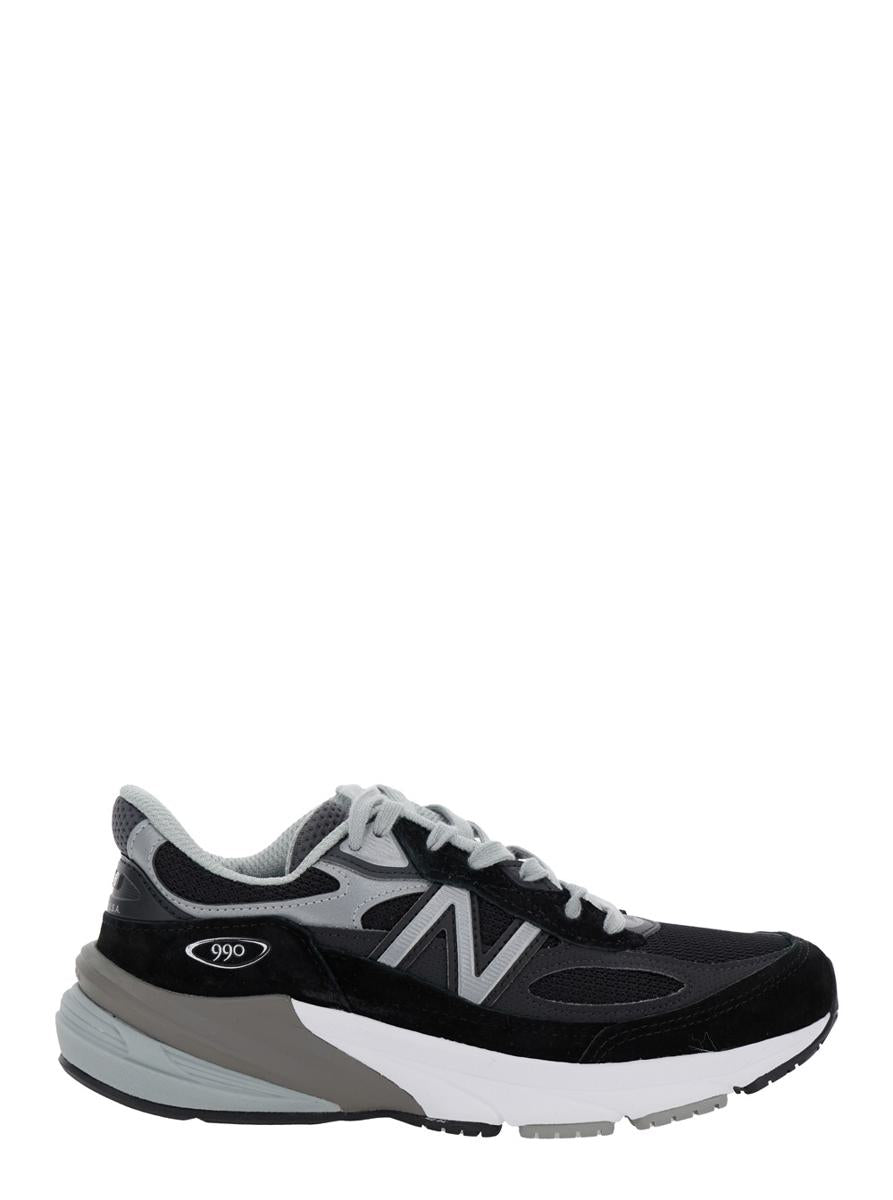 Svarta låga sneakers med logotypdetalj i mocka och tekniskt tyg för kvinnor